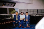 Photo: Pyongyang MMS desk with venue staff and Bob Hartley.